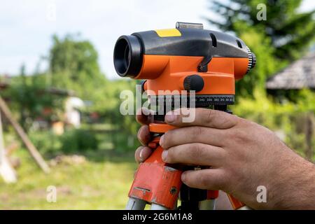 Automatic Level. Workers are working on the construction site and preparing for construction. Stock Photo