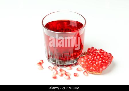 Glass of pomegranate juice and ingredient on white background Stock Photo