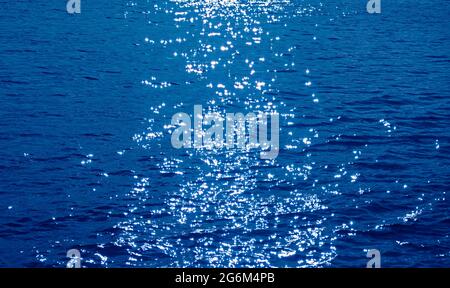 Pop art style cobalt blue colored sparkling water surface with the sea ripples Stock Photo