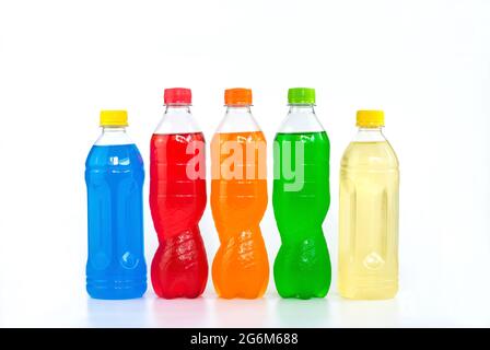 Multi colored drinks in plastic bottles isolated on white background. Stock Photo
