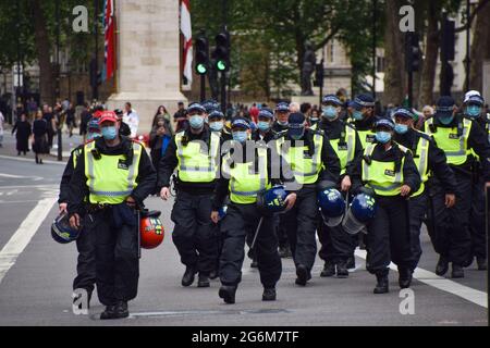 London, United Kingdom. 26th June 2021. Riot police take their positions in Whitehall and Parliament Square during the protests. Several protests took place in the capital, as pro-Palestine, Black Lives Matter, Kill The Bill, Extinction Rebellion, anti-Tory demonstrators, and various other groups marched through Central London. Stock Photo