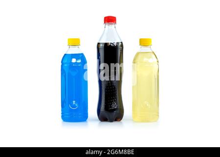 Multi colored drinks in plastic bottles isolated on white background. Stock Photo