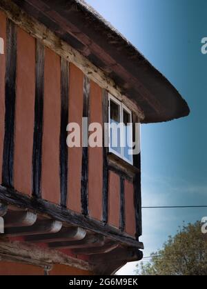 Close up of a corner of Timber framed Thatched house in quintessential picture-postcard Kersey Suffolk England
