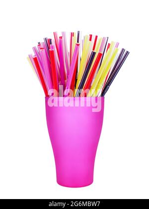 Colorful plastic straws in cup white background isolated closeup, disposable drinking pipes in glass, tubes for beverage, cocktail, water, fruit juice Stock Photo