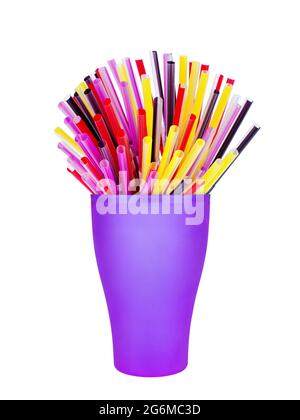 Colorful plastic straws in cup white background isolated closeup, disposable drinking pipes in glass, tubes for beverage, cocktail, water, fruit juice Stock Photo