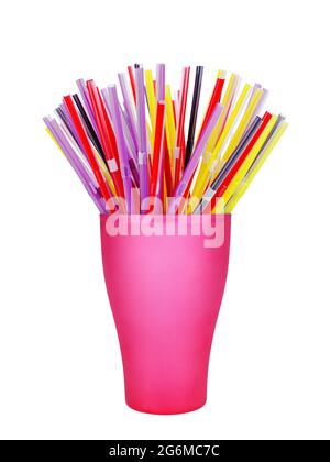 Colorful plastic straws in cup white background isolated closeup, disposable drinking pipes in glass, tubes for beverage, cocktail, water, fruit juice Stock Photo