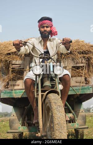 Young Adult man driving machine rickshaw Stock Photo
