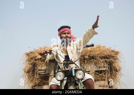 Young Adult man driving machine rickshaw Stock Photo