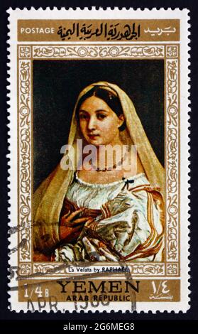 YEMEN - CIRCA 1968: a stamp printed in the Yemen Arab Republic shows Woman with a Veil, Painting by Raphael, Italian Painter, circa 1968 Stock Photo