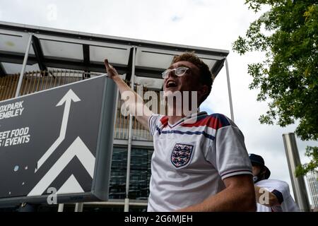 London, UK, 7th July 2021. England fans outside the ground ahead of the Euro 2020 semi-final against Denmark at Wembley Stadium, London on Wednesday 7th July 2021. (Credit: Ben Pooley | MI News) Credit: MI News & Sport /Alamy Live News