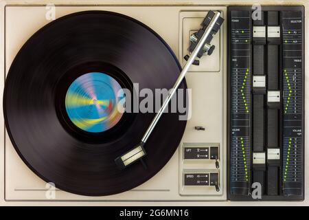 View from above of a vintage turntable with spinning record Stock Photo