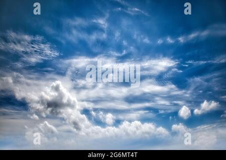 CONCEPT PHOTOGRAPHY: Blue sky with dramatic cloud formation Stock Photo