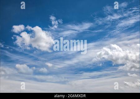 CONCEPT PHOTOGRAPHY: Blue sky with dramatic cloud formation Stock Photo