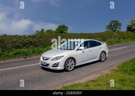 2010 white (60) Mazda Sport 6 speed manual 2488cc petrol 4dr saloon en-route to Capesthorne Hall classic May car show, Cheshire, UK Stock Photo