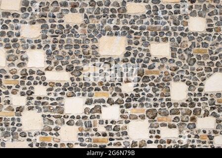 Knapped Flint wall Kent England UK GB Europe - Fancy stone and flint wall pattern texture background Stock Photo