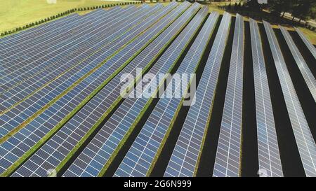 Drone high angle view of solar energy photovoltaic PV panels background. Stock Photo