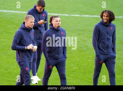 England goalkeeper Aaron Ramsdale (left), Kalvin Phillips and England’s Dominic Calvert-Lewin (right) on the pitch before the UEFA Euro 2020 semi final match at Wembley Stadium, London. Picture date: Wednesday July 7, 2021. Stock Photo
