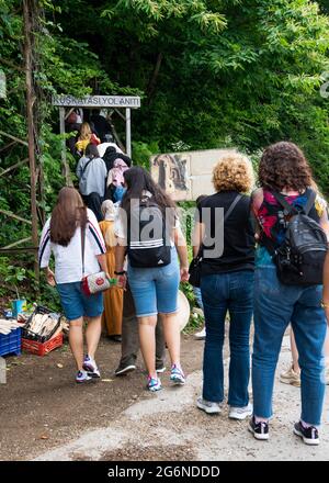 Amasra, Turkey- June 26 2021: Tourists on the road for the Roman monument (Kuskayasi Aniti in Turkish) Stock Photo