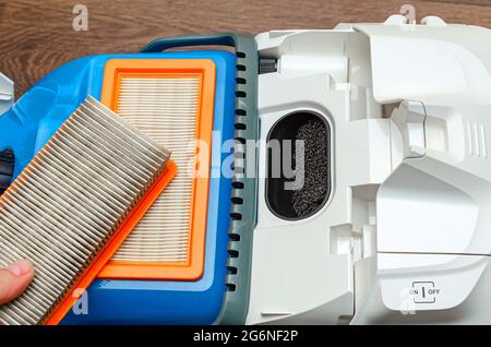 Vacuum cleaner filter with water filter. Large white vacuum cleaner on a brown floor Stock Photo