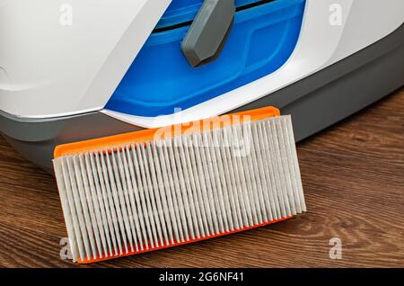Vacuum cleaner filter with water filter. Large white vacuum cleaner on a brown floor Stock Photo