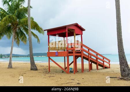 Luquillo Beach, Puerto Rico. Clouds, palms, lifeguard house Stock Photo