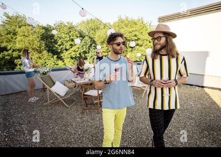 Guys on a rooftop party Stock Photo