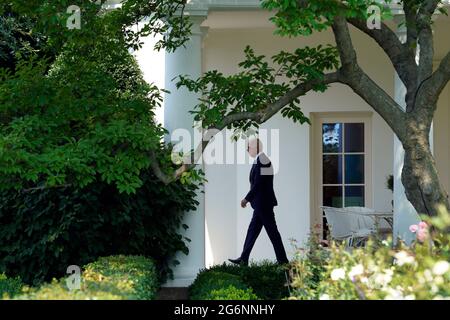 United States President Joe Biden walks from the Oval Office of the White House in Washington before his departure to Chicago on July 7, 2021. Biden is going to deliver remarks on his Build Back Better agenda at McHenry County College in Crystal Lake, Illinois. Credit: Yuri Gripas/Pool via CNP Stock Photo