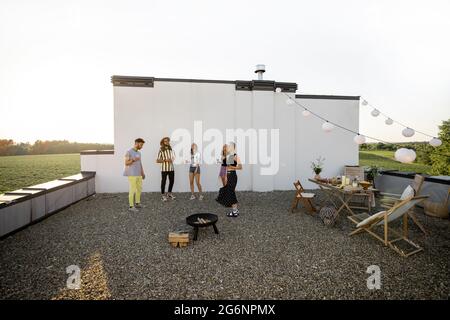 Stylish friends dancing at party outdoors Stock Photo