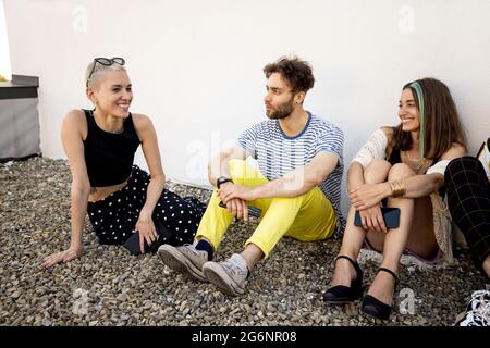 Friends talking outdoors Stock Photo