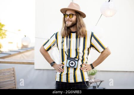 Stylish male photographer outdoors Stock Photo