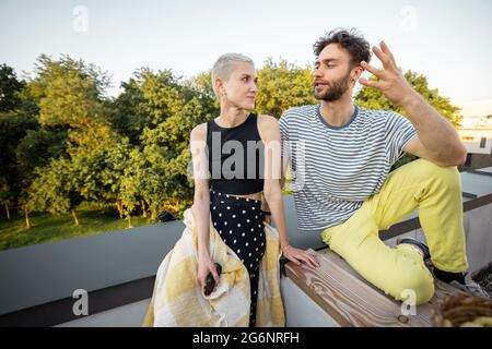 Two friends hanging out at picnic outdoors Stock Photo