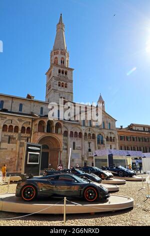 MODENA, ITALY, July 1 2021 - Motor Valley Fest exhibition, Pagani super cars stand in the old square with Ghirlandina tower Stock Photo