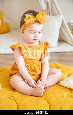 Cute baby girl in yellow dress sale