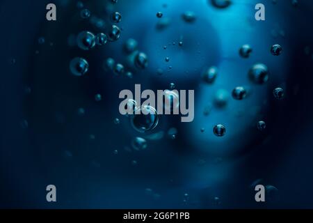 Abstract background of dark blue color bubbles in liquid.  Stock Photo
