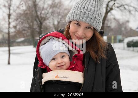 A portrait of a mother and son on a snowy day Stock Photo