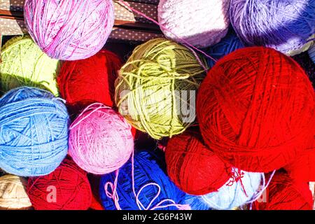 Set of multicolored yarn for knitting. Knitting wool yarn. Idea for a photography area. Selective focus. Stock Photo