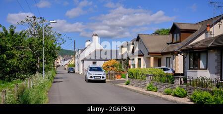 Clean, painted row of traditional cottages on Annanside in Moffat Stock Photo