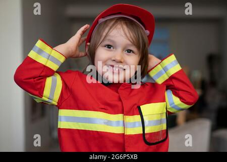 A young boy dressed up as a fireman Stock Photo