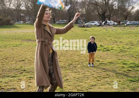 A young boy flying a kite in London Stock Photo
