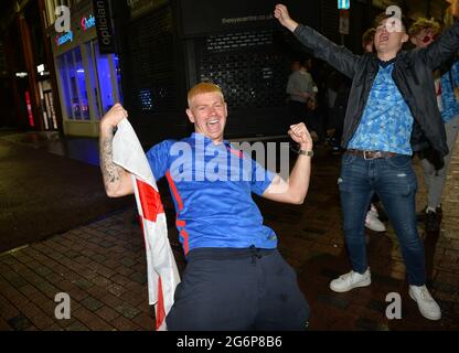 Leicester, Leicestershire, UK 7th July 2021. UK News. Football fans celebrate in Leicester City Centre after England beat Denmark to reach the final of Euro 2020. Alex Hannam Credit: Alex Hannam/Alamy Live News Stock Photo