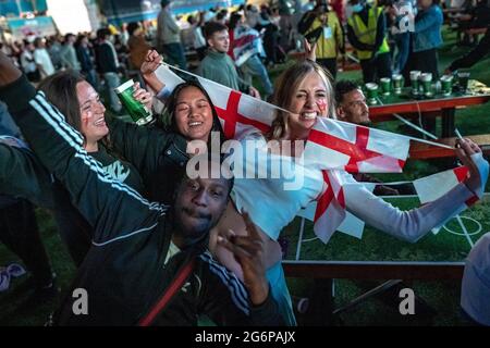 London, UK. 7th July, 2021. UEFA EURO 2020: England fans celebrate in Trafalgar Square as England wins 2-1 in extra time against Denmark in the semi-finals. Credit: Guy Corbishley/Alamy Live News