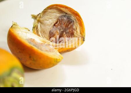 Sliced betel nut on isolated white, betel nut for pan Stock Photo