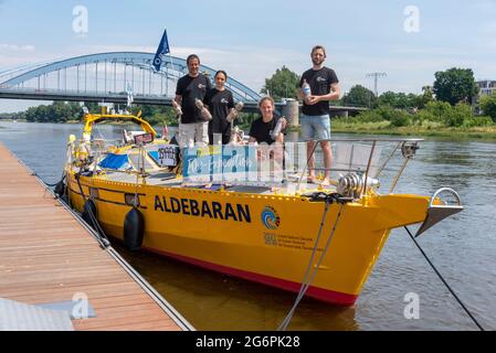 Magdeburg, Germany. 28th June, 2021. The crew of the research vessel 'Aldebaran' shows PET bottles filled with cigarette butts. The scientists are on the Elbe for four weeks to draw attention to the global plastic problem. With the support of numerous environmental initiatives, they are collecting cigarette butts in several cities along the Elbe. This is the largest collection campaign of its kind in Germany. It is intended to draw attention to the fact that carelessly discarded cigarette butts can contaminate river water. Credit: Stephan Schulz/dpa-Zentralbild/ZB/dpa/Alamy Live News Stock Photo