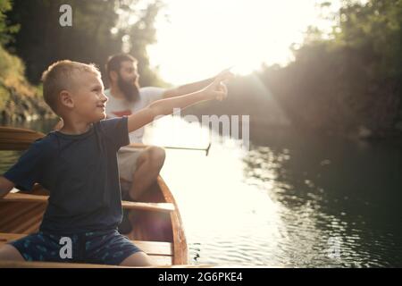 Father and son enjoy time on the lake Stock Photo