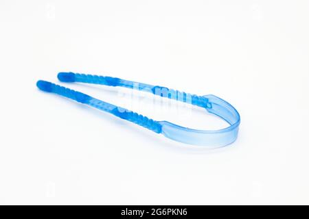 A picture of tungue cleaner isolated on white background Stock Photo