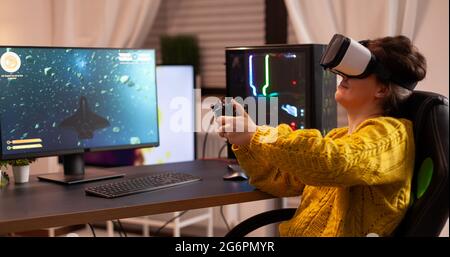 Pro woman egame cyber playing online with virtual reality headset and  wireless controller. Virtual space shooter championship in cyberspace,  esports player performing on pc during gaming tournament Stock Photo - Alamy