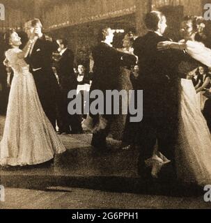 Ballroom dancing. A press image of British dancers enjoying a quickstep, circa 1940, in formal dress. The quickstep is considered by some to be a very fast foxtrot or a onestep. Stock Photo