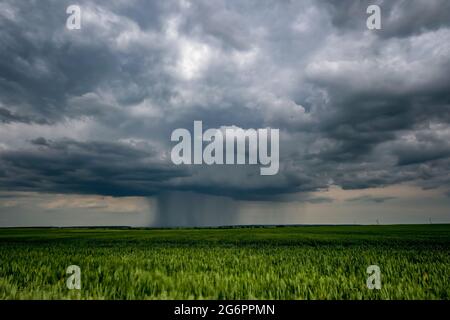 landscape with dark sky with rain clouds before storm. thunderstorm front Stock Photo