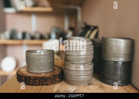 Pottery workshop products on table close up. Handmade, creativity and hobby concept. Stock Photo