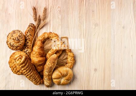 Composition with bakery products on wooden background, copy space Stock Photo